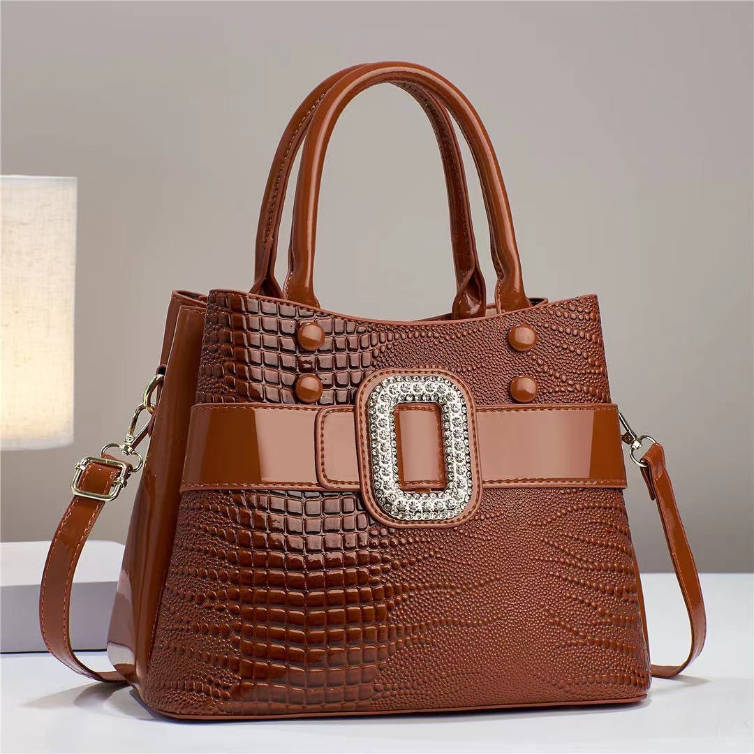 Cartera Bucket Estampado Lagarto con Bandolera