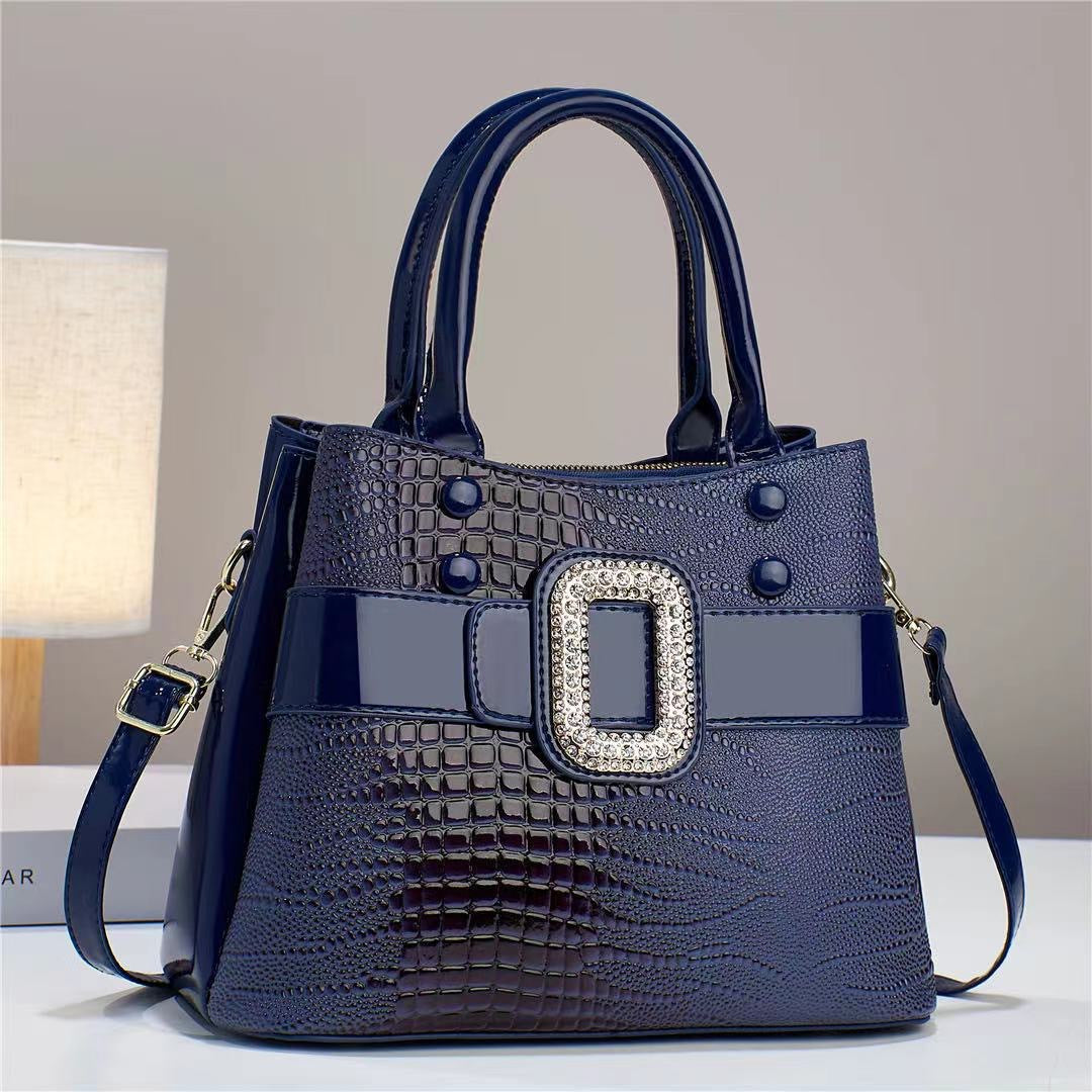 Cartera Bucket Estampado Lagarto con Bandolera