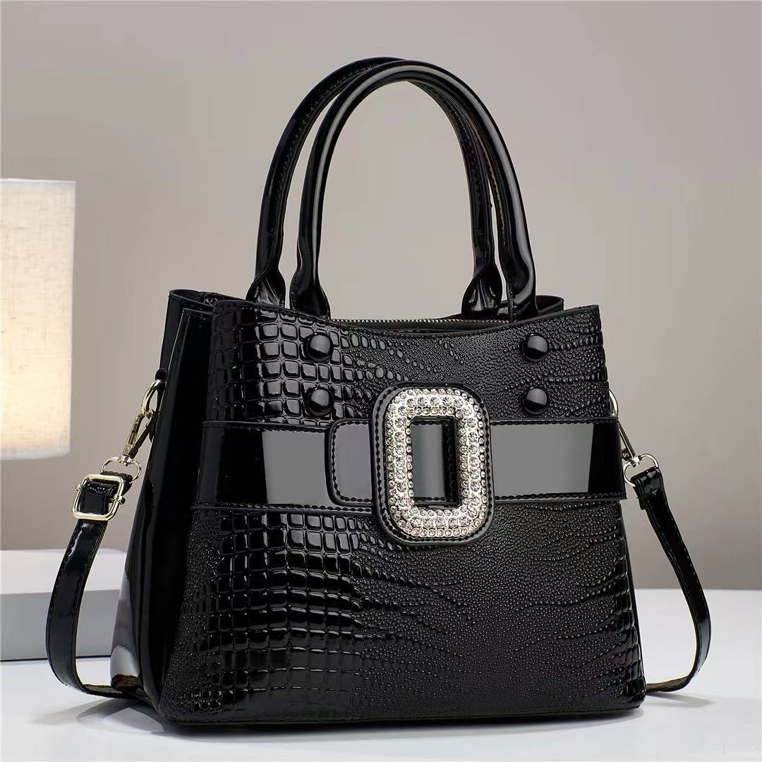 Cartera Bucket Estampado Lagarto con Bandolera