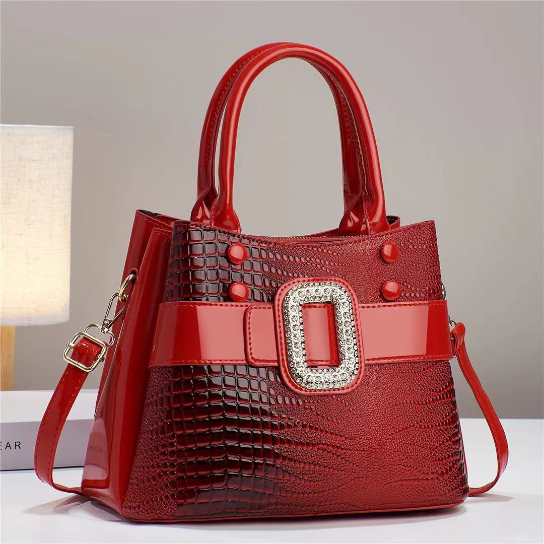 Cartera Bucket Estampado Lagarto con Bandolera